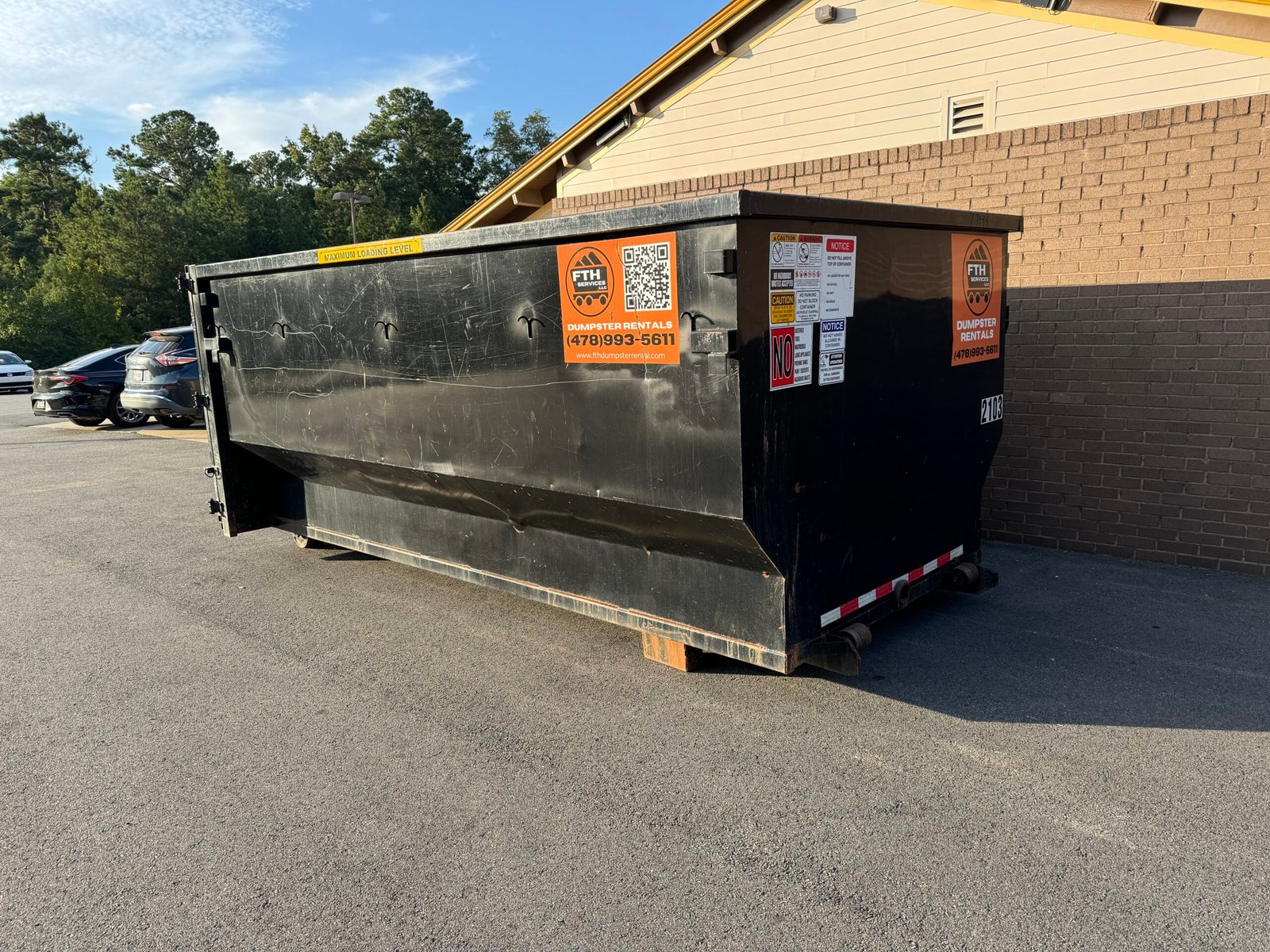 Dumpster-Rental-Macon-GA-FTH-Services FTH Services 20-yard roll-off dumpster rental delivered to a residential driveway in Macon, GA