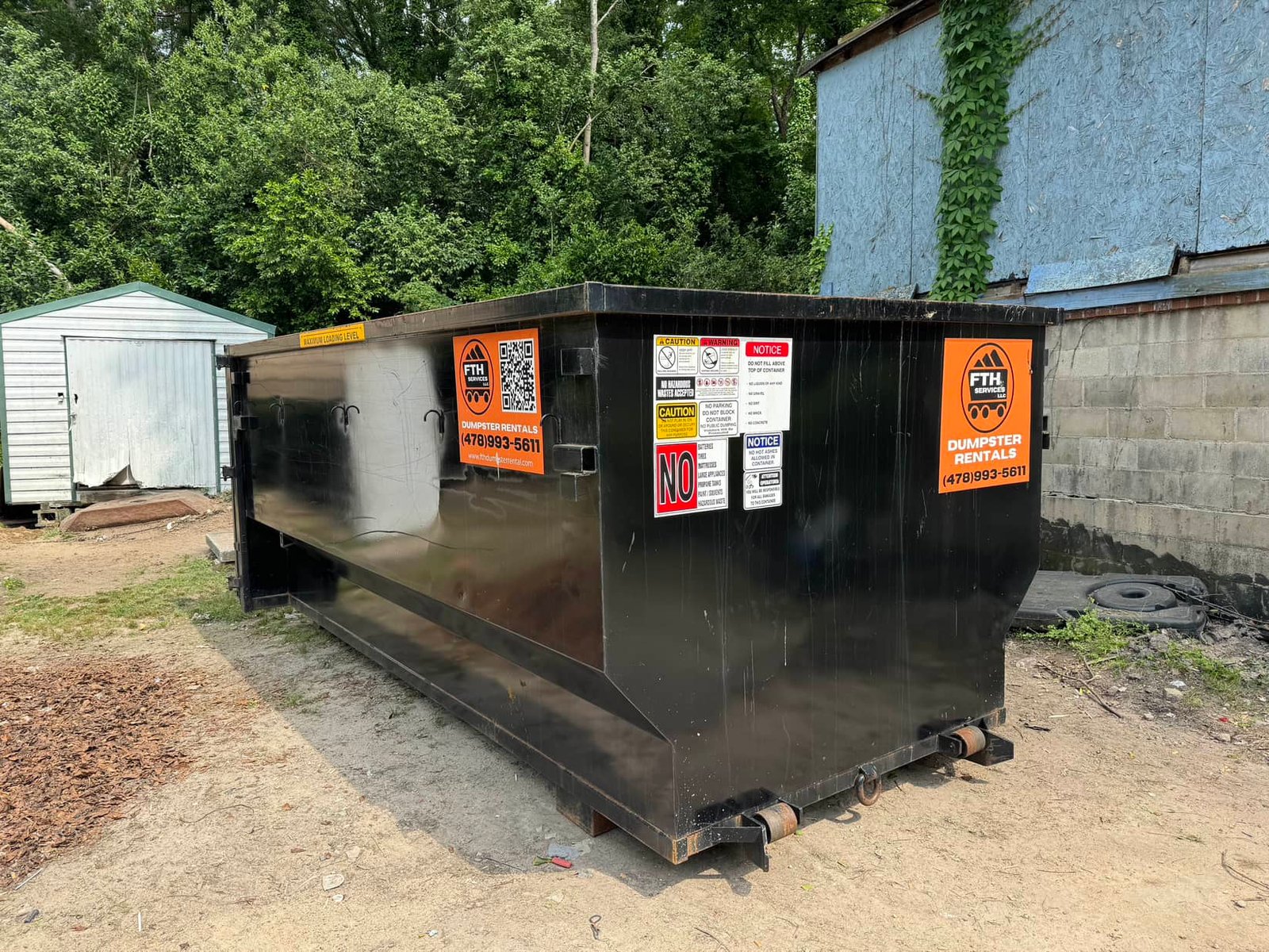 Dumpster Rental Barnesville GA - FTH Services FTH Services 20-yard roll-off dumpster delivered to a residential driveway in Barnesville, GA