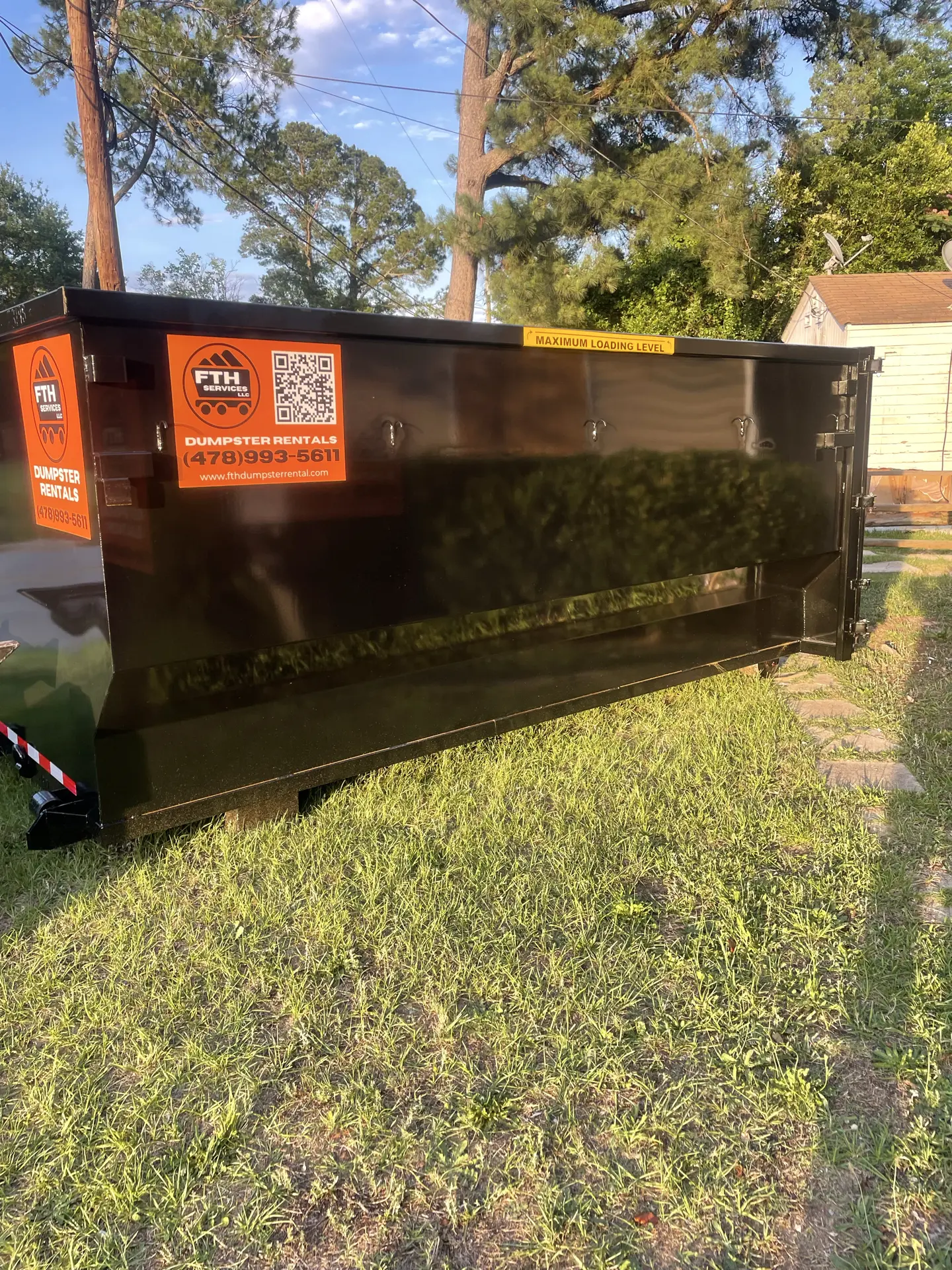 Roll-off dumpster rental available in Forsyth GA for residential commercial and construction projects by FTH Services
